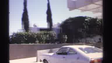 Guaymas Mexico (1975): A Row Of Vintage Automobiles Parked In Front Of A Large