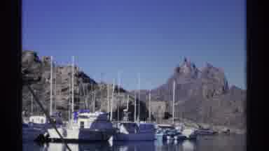 Guaymas Mexico-1975: Boats Docked In Marinas Against Mountain Backdrop