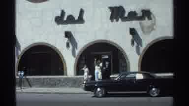 Guaymas Mexico (1975): People Wave And Walk Outside Of A Building