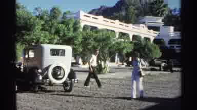 Guaymas Mexico (1975): Man Checking Out Woman While Passing By In Parking Lot