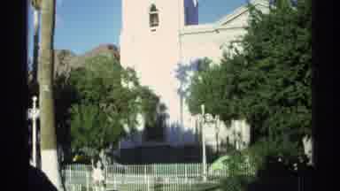 Guaymas Mexico (1975): A White Church And A Beautiful Green Tree Against A Blue