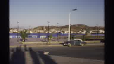 Guaymas Mexico (1975): Scenery Of A Street Ne Ear A Water Front And A Person With