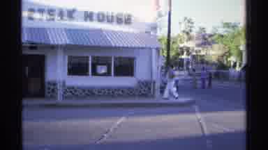 Guaymas Mexico (1975): People Walking Past A Restaurant Called Steakhouse