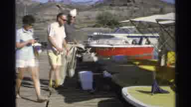 Guaymas Mexico (1975): Two Men Help A Woman Get Into The Passenger Boat But The