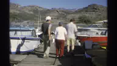 Guaymas Mexico (1975): Two Men Help An Older Woman Get To A Passenger Boat