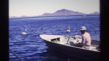Guaymas Mexico (1975): Two Men On A Machine-Operated Boat