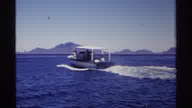Guaymas Mexico (1975): View Of Person Driving Red Speedboat On A Bright Sunny Day