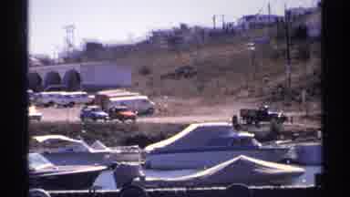 Guaymas Mexico (1975): Cars And Vans Parked Next To A Pier Or Boat Harbor With