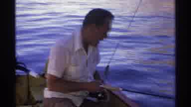 Guaymas Mexico (1975): Man Fishing Looks Into The Dark Water As He Waits For The