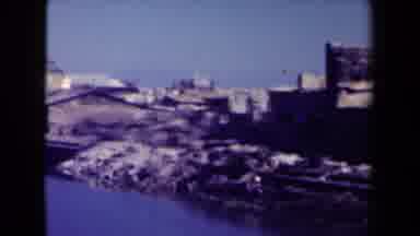 MANILLA PHILIPPINES--194: View Of Wooden Buildings Next To Calm River On A Clear