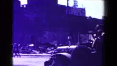 MANILLA PHILIPPINES--194: The Jeep Drives Down The Road And Past The Buildings