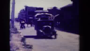 MANILLA PHILIPPINES--194: Old-School Cars In A Busy Street