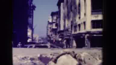 MANILLA PHILIPPINES--194: People Walk Down The Sidewalk That Sits Under The Tall