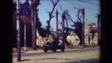 MANILLA PHILIPPINES--194: Classic Cars Driving On A Street Maybe In A Western