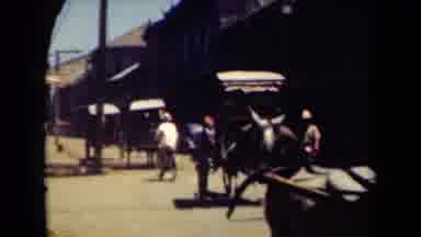 MANILLA PHILIPPINES--194: Horse Pulling A Covered Cart Through A Populated Urban