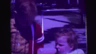 LYNBROOK NEW YORK-broo: Boy And Baby Stand Next To One Another While Toddler