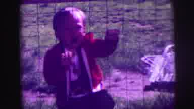 LYNBROOK NEW YORK-broo: A Frustrated Baby Boy Wants To Jump The Fence