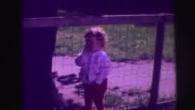 LYNBROOK NEW YORK-broo: Baby Wearing White Sweater Sucks Finger While Standing