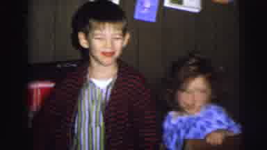 MOBILE ALABAMA-ile-: Children Dressed In Pajamas In A Basement Laughing And