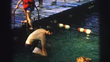 MOBILE ALABAMA-ile-: People Swimming In Lake With Kids Walking On The Boardwalk