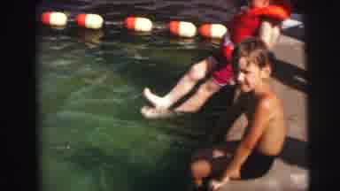 MOBILE ALABAMA-ile-: People Swimming In Large Pool Two Young Boys Wearing Life