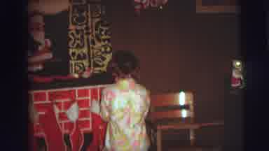 AUGUSTA GEORGIA-usta: Kid Hanging Stocking In Fireplace And Turning Around With