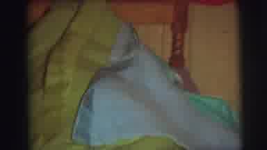 AUGUSTA GEORGIA-usta: A Young Child Playing Under The Covers Of A Bed