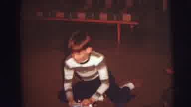 AUGUSTA GEORGIA-usta: Kid Playing On The Rug With His Toy
