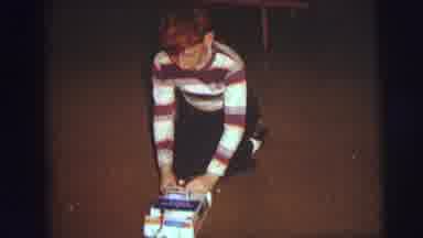AUGUSTA GEORGIA-usta: Boy Wearing Brown Striped Shirt Sits On Knees Looking At