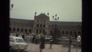 Andalusia Spain-1978: Historic Building And Street Scene With Pedestrians And Cars