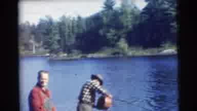Traverse City Michigan-1956: Two Men Fishing On A Lake