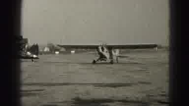 Harrisburg Penn (1946): White Airplane Parks Next To Black Airplane On A Sunny Day