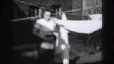 Harrisburg Penn (1946): Young Lady Is Getting The Laundry Done By Caning Bed
