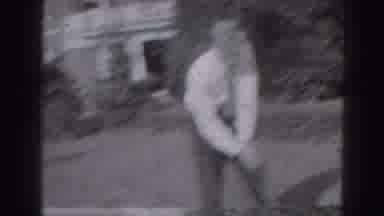 Harrisburg Penn (1946): Man Practicing His Golf Swing On A Grassy Lawn By A House