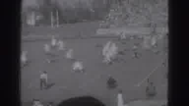 Harrisburg Penn (1946): A Group Of Rugby Players Are Playing In the Ground With