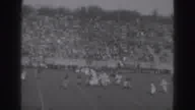 Harrisburg Penn (1946): Black And White Footage Of Players Tackling During