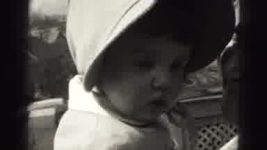 Harrisburg Penn (1946): Girl Wearing Tan Bonnet Looks At Camera On A Sunny Day