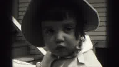Harrisburg Penn (1946): A Little Girl With Short Hair And Wearing A Bonnet Stands