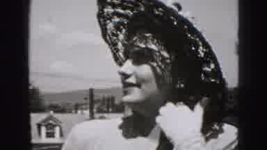 New Cumberland Penn (1946): A Smiling Woman Wearing A Hat Flips Her Hair While