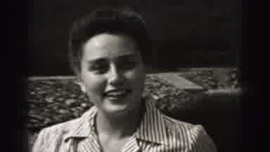 New Cumberland Penn (1946): Woman Wearing Striped Shirt Looks At Small Black Dog
