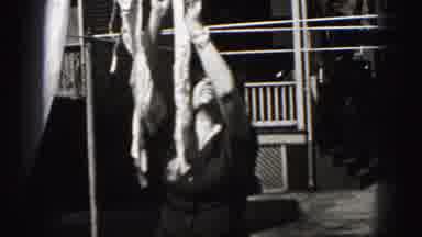 New Cumberland Penn (1946): Woman Hangs Her Clothings While Her Son Plays Scooter