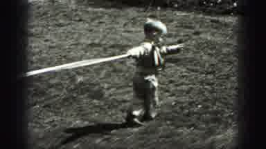 New Cumberland Penn (1946): Handsome Little Boy Pulls Out A Rope Happily
