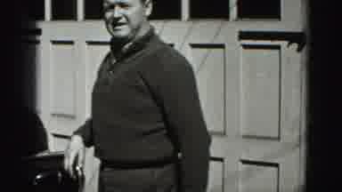 New Cumberland Penn (1946): Man Shakes Out A Hand Towel Wipes His Hands Then Walks