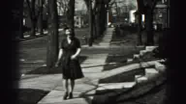 New Cumberland Penn (1946): Young Woman Flirty Walking And Buttoning Up Her Blouse