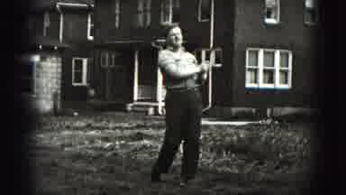 New Cumberland Penn (1946): Man Practicing Golf Swing In Front Yard