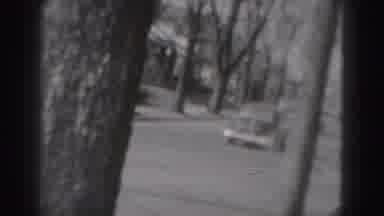 New Cumberland Penn (1946): Man In Uniform Walking Outside Car Drives Down Tree