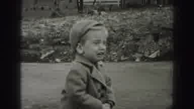 New Cumberland Penn (1946): Child Wearing Grey Coat Cries As Woman Walks Out Of