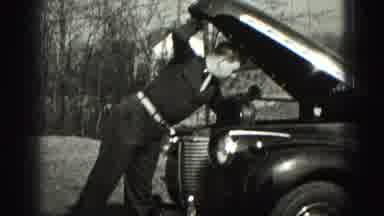 Apparently, checking his car engine is a hobby, not a necessity!