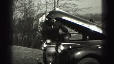 New Cumberland Penn (1946): Man Reaches Into Engine Bay To Work On Car And Then