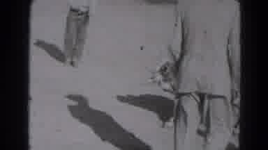 Lincoln Nebraska (1947): Man Wearing White Shirt Falls To Ground Trying To Wrestle